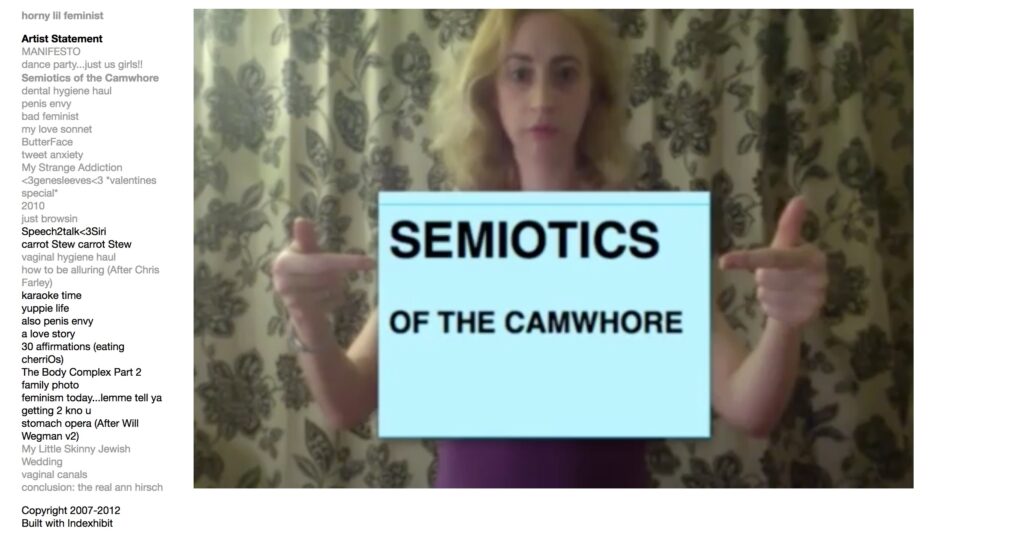 woman poster that writes: semiotics of the cawhorelding a